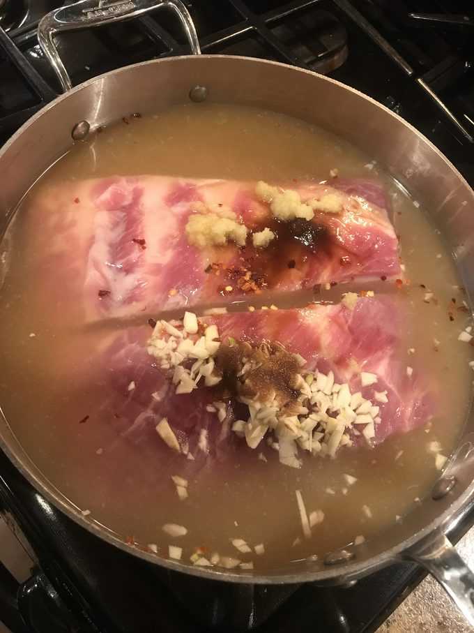 pork belly simmering in fragrant broth | savorwithjennifer.com