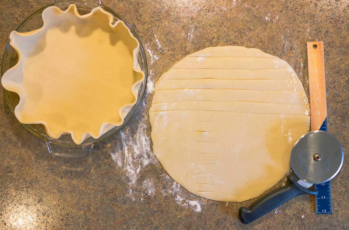 two pie crusts being prepared