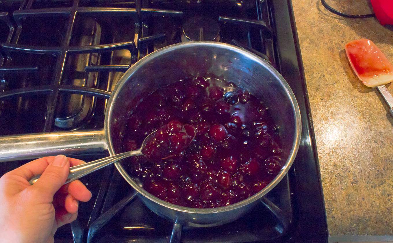 saucepan with cherry pie filling being simmered