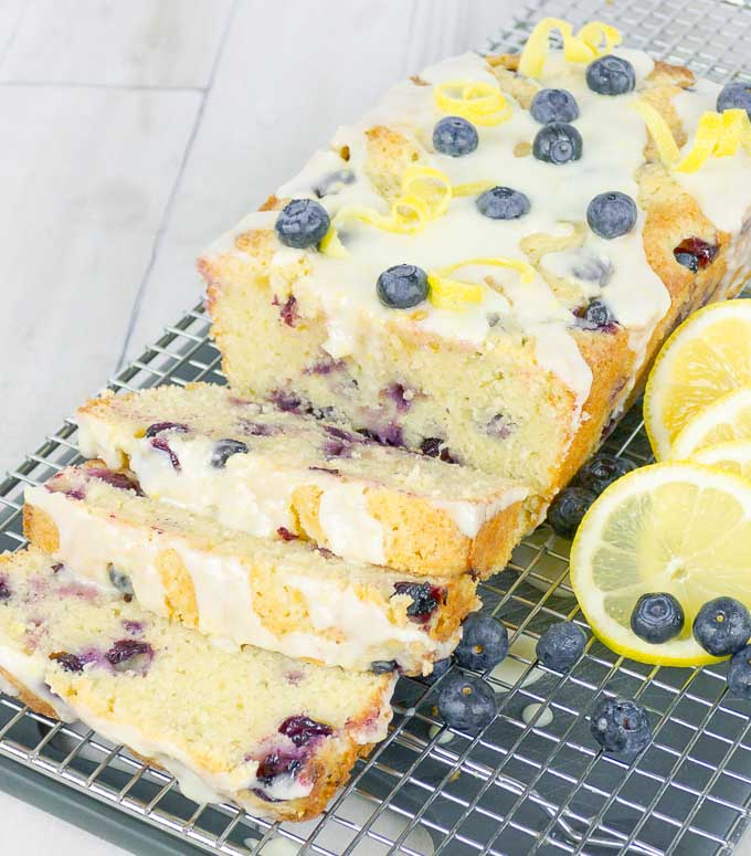 Blueberry Lemon Sour Cream Pound Cake sliced on wire rack