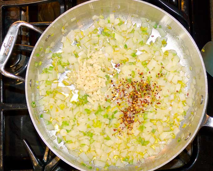 onion, garlic, chili flakes, celery, oil in saute pan