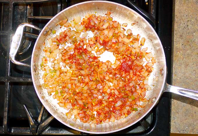onion, garlic, celery, chili flakes, tomato paste in saute pan