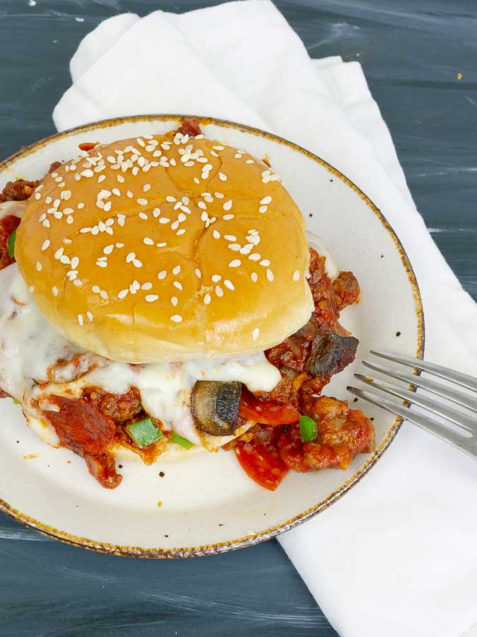 pizza sloppy joe sandwich on white plate