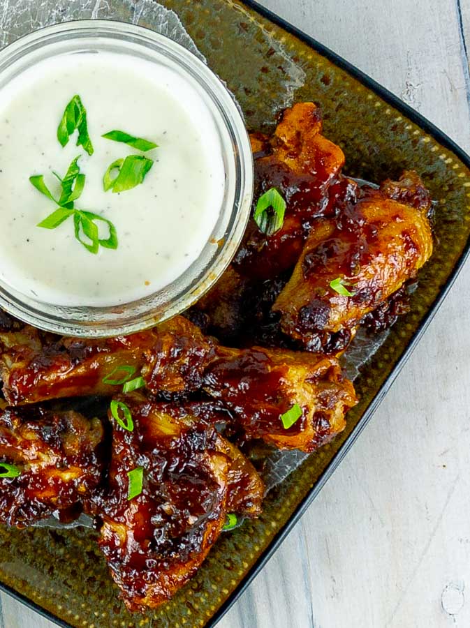Baked Chipotle Barbecue Wings on square plate with ranch