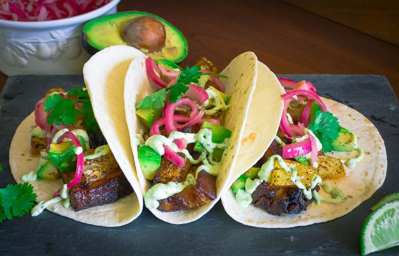 Pork Belly Tacos with Pickled Onion, Roasted Pineapple, and Avocado Lime Sour Cream | Savorwithjennifer.com