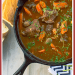 Red Wine Stew on caste iron with french bread