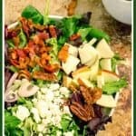 Crunchy Apple and Bacon Salad with Candied Pecans in a white dish