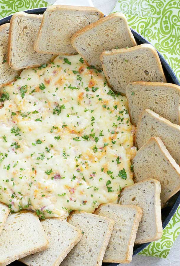 Ultimate Reuben Dip surrounded with rye bread squares