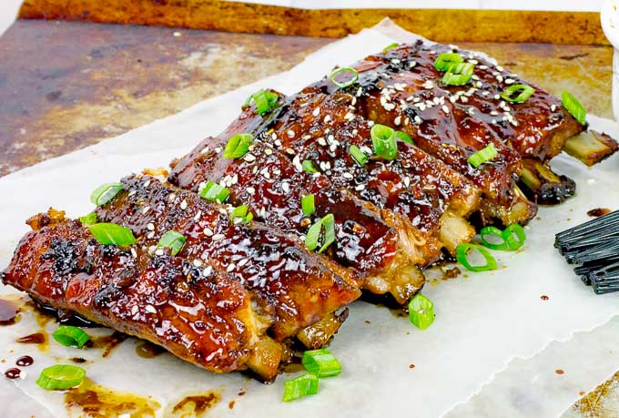 Sticky Asian Baked Pork Ribs on metal baking sheet