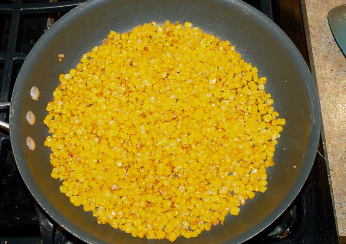 corn being seared in hot pan