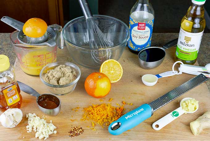 ingredients for Sticky Orange Chicken Recipe on a cutting board