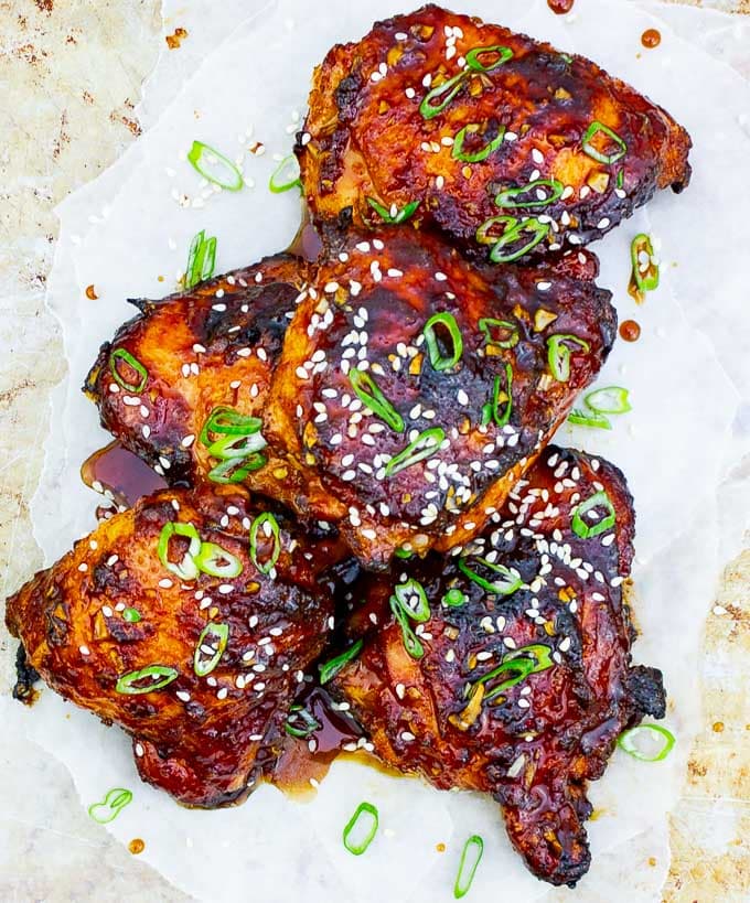 Sticky Asian Grilled Chicken Thighs on white background