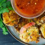 Coconut Shrimp on plate with bowl of peach chili sauce