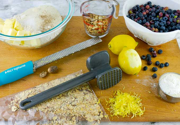 ingrediants for Fresh Blueberry Almond Crumb Pie on cutting coard