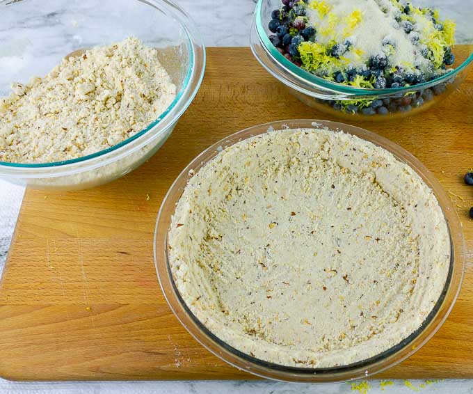 crust and crumble for blueberry pie with filling in a seperate bowl