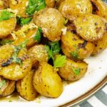 Roasted Lemon Parsley Butter Potatoes on a white plate