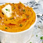 right side of white bowl of Roasted Savory Mashed Sweet Potatoes