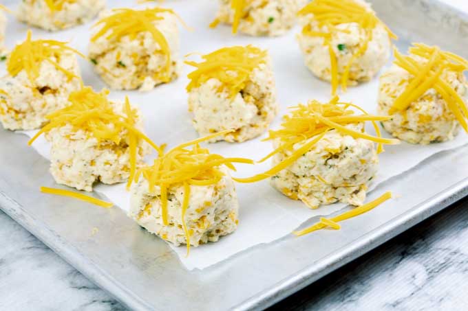 uncooked Italian Herb Garlic Cheddar Biscuits on baking sheet