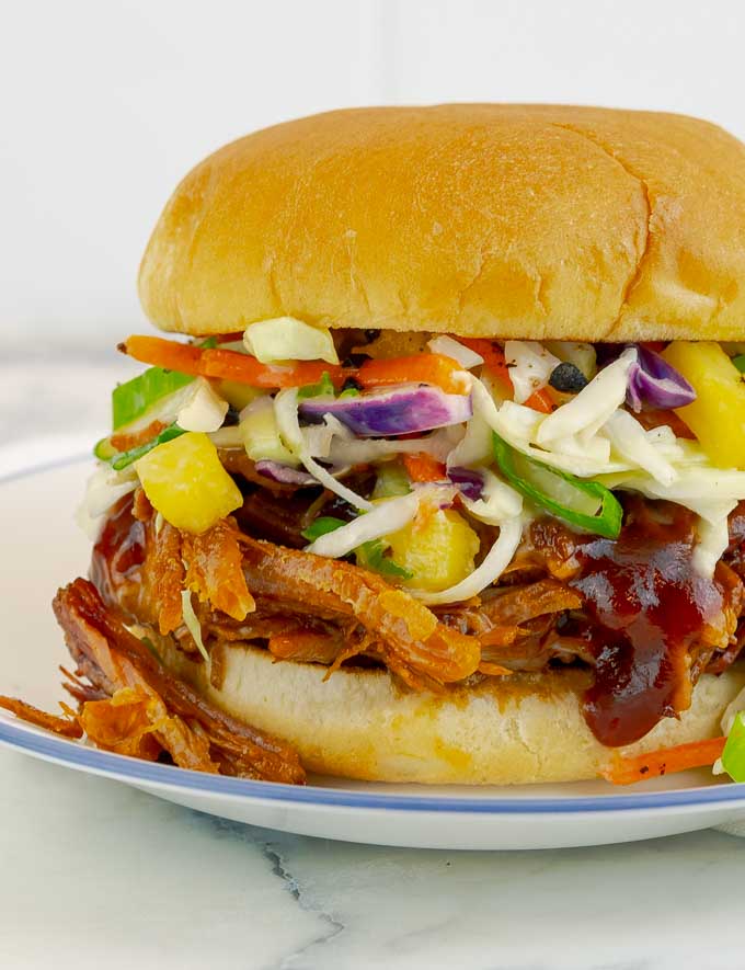 barbecued pulled pork and pineaple slaw sandwich