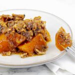 white plate and fork of Slow Cooker Sweet Potato Casserole