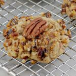a butter pecan cookie on metal cooling rack