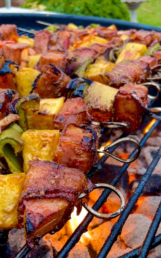 fire underneath of Bourbon Bacon Ham and Pineapple Kabobs on the Grill