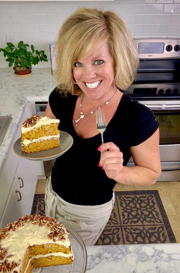 Jennifer holding a slice of carrot cake