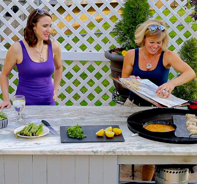 Jennifer and Guest putting Grilled Shrimp Cakes on the barbecue grill