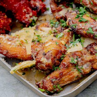 Best Garlic Parmesan Wings on the Grill on a metal baking sheet