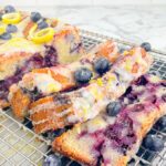 slices of Blueberry Lemon Sour Cream Pound Cake on wire cooking rack