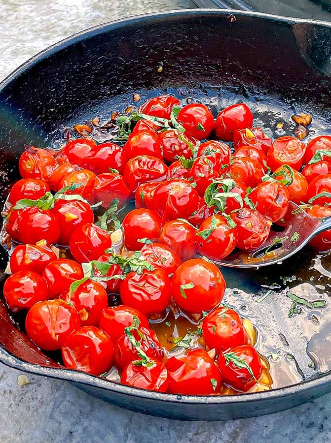 cast iron skillet of Blistered Cherry Tomatoes
