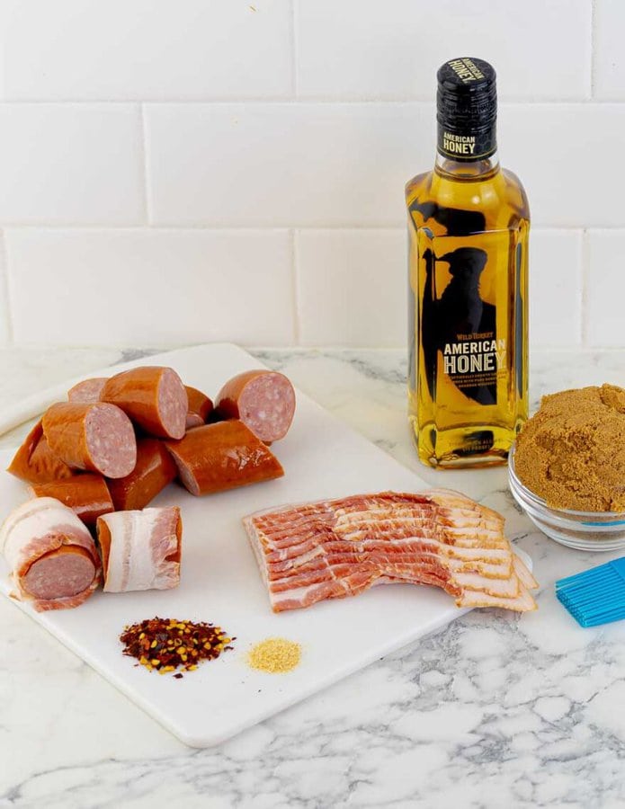 ingredients being prepped for Bourbon Brown Sugar Bacon Wrapped Sausages