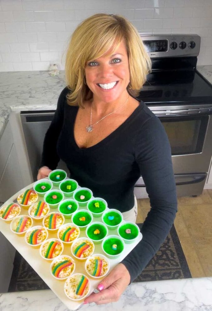 Jennifer holding a tray of pot o' gold and key lime lucky charms jello shots