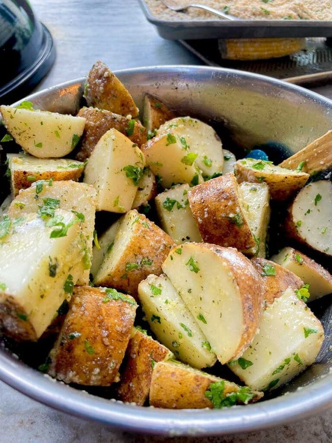 bowl of potatoes tossed with ranch, olive oil, and parsley