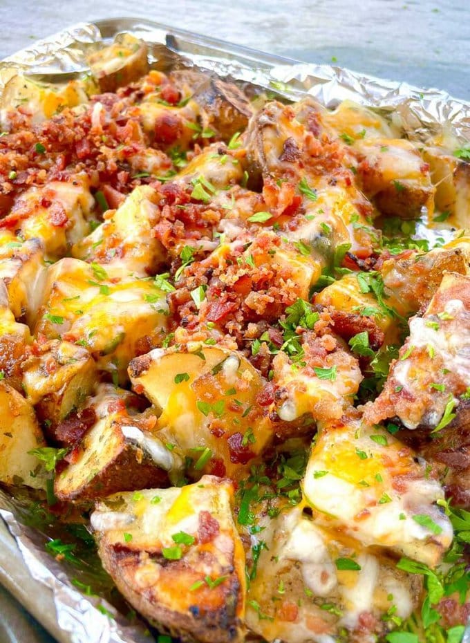 foil lined pan of Grilled Cheesy Ranch Loaded Potatoes