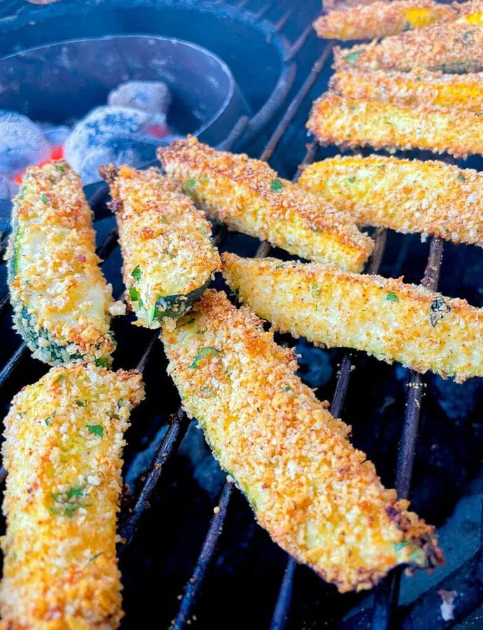 Grilled Panko Parmesan Zucchini Fries on the barbecue grates.