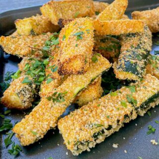 Grilled to crispy, golden flavorful perfection, these zucchini fries are tender and luscious on the inside with a buttery, herb flavor crusted Panko and Parmesan crust. Grilled Panko Parmesan Zucchini Fries will be the Summer side dish you didn't know you were missing!