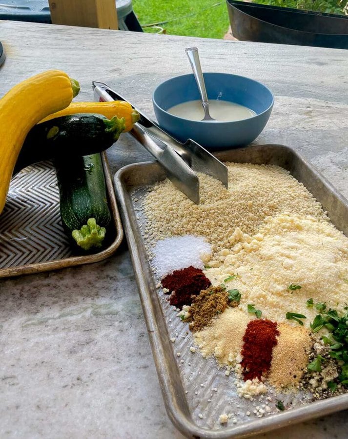 ingredients being prepared for Grilled Panko Parmesan Zucchini Fries