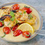 Grilled Italian Shrimp and Parmesan Polenta with Blistered Tomatoes on gray plate